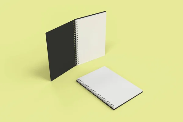 Dos cuadernos con espiral encuadernada sobre fondo amarillo —  Fotos de Stock