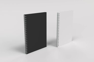 Beyaz arka plan üzerinde iki defter spiral ile bağlı