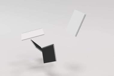 Beyaz arka plan üzerinde dört defter spiral ile bağlı