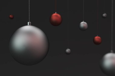 Siyah zemin üzerine kırmızı ve gümüş Noel topları kümesi