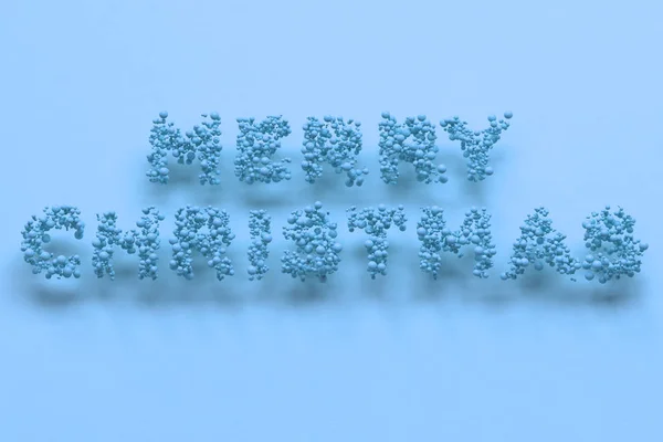 Feliz Natal palavras de bolas azuis no fundo azul — Fotografia de Stock