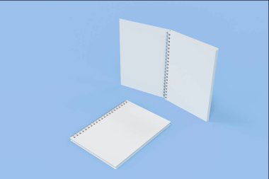 İki defter spiral ile mavi arka plan üzerinde bağlı