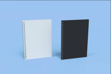 İki defter spiral ile mavi arka plan üzerinde bağlı