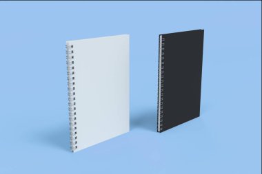 İki defter spiral ile mavi arka plan üzerinde bağlı