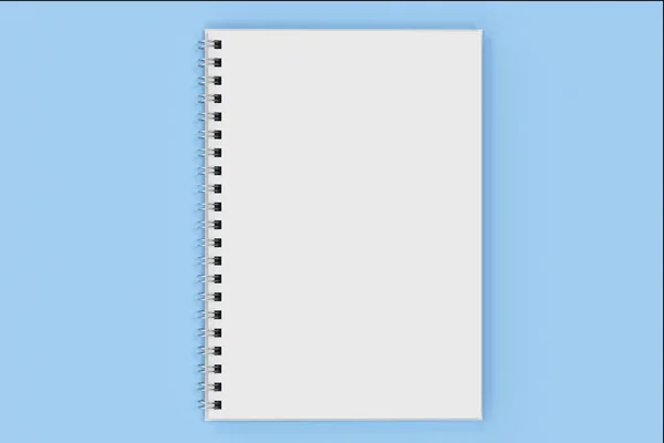 Opend notebook spiral bound on blue background
