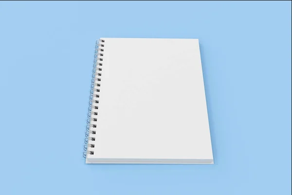 Abrir espiral notebook encadernado no fundo azul — Fotografia de Stock