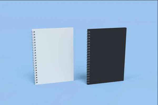 Dos cuadernos con espiral encuadernada sobre fondo azul —  Fotos de Stock