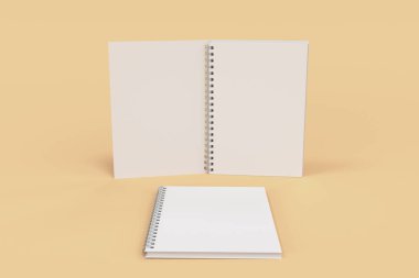 Turuncu zemin üzerine iki defter spiral ile bağlı