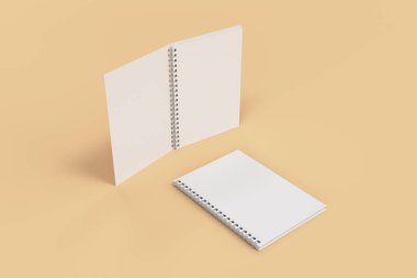 Turuncu zemin üzerine iki defter spiral ile bağlı