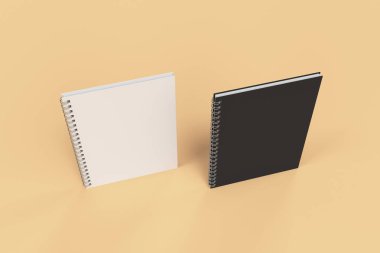 Turuncu zemin üzerine iki defter spiral ile bağlı