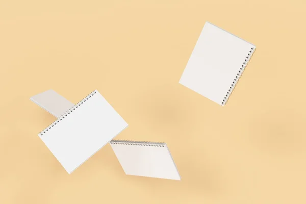 Quatro cadernos com encadernação em espiral em fundo laranja — Fotografia de Stock