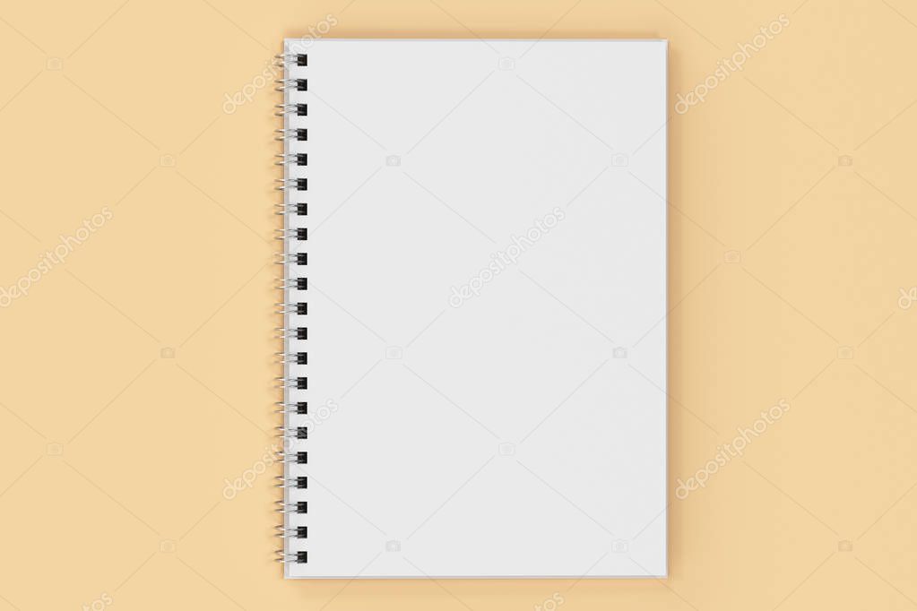 Opend notebook spiral bound on orange background