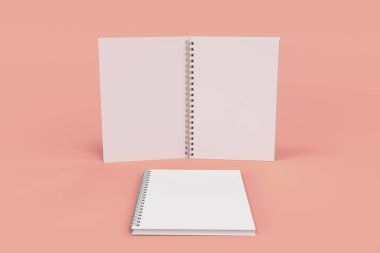 Kırmızı zemin üzerine iki defter spiral ile bağlı