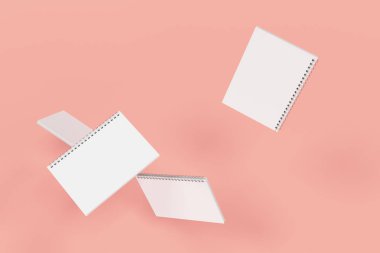 Kırmızı zemin üzerine dört defter spiral ile bağlı