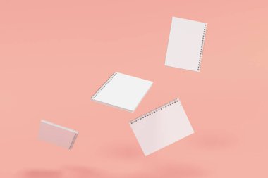 Kırmızı zemin üzerine dört defter spiral ile bağlı