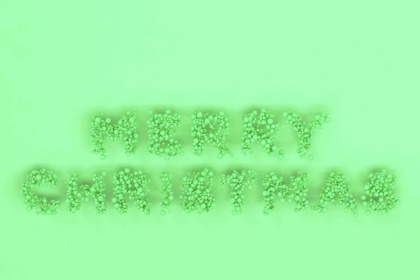 Joyeux Noël mots de boules vertes sur fond vert — Photo