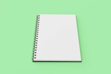 Yeşil arka plan üzerinde bağlı Garı defter spiral