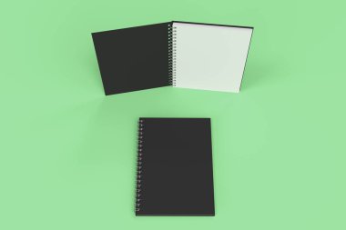 Yeşil arka plan üzerinde iki defter spiral ile bağlı