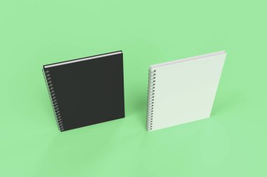 Yeşil arka plan üzerinde iki defter spiral ile bağlı