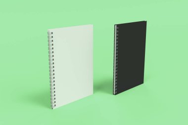 Yeşil arka plan üzerinde iki defter spiral ile bağlı