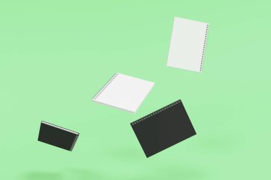 Yeşil arka plan üzerinde dört defter spiral ile bağlı