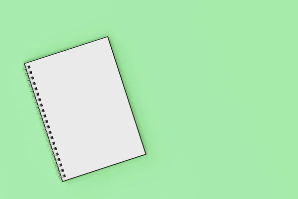 Відкрити спіраль ноутбука, прив'язаний до зеленого фону — стокове фото