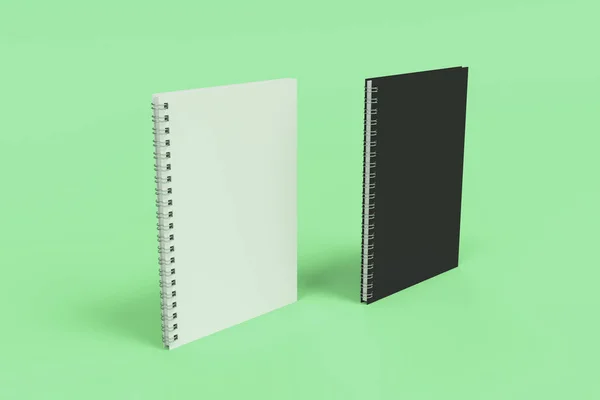 Dos cuadernos con espiral encuadernada sobre fondo verde — Foto de Stock