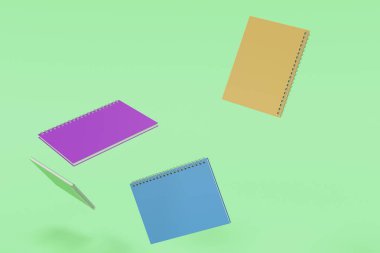 Yeşil arka plan üzerinde dört defter spiral ile bağlı