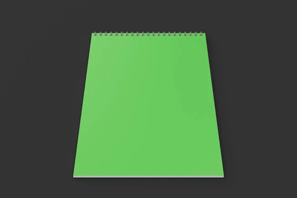 Зеленый блокнот с металлической спиралью на черном фоне — стоковое фото