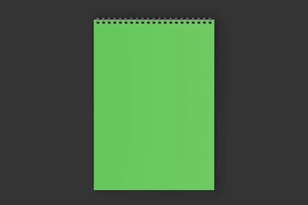 Notebook hijau kosong dengan logam spiral terikat pada latar belakang hitam — Stok Foto