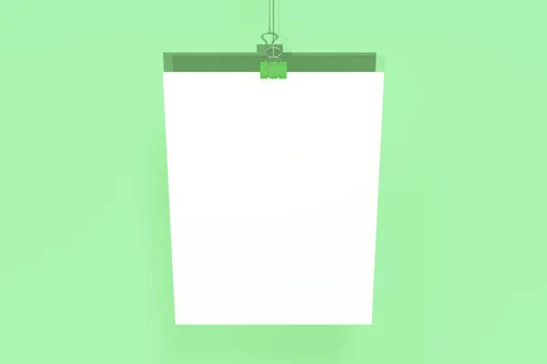 Lege witte poster met binder clip mockup op groene achtergrond — Stockfoto