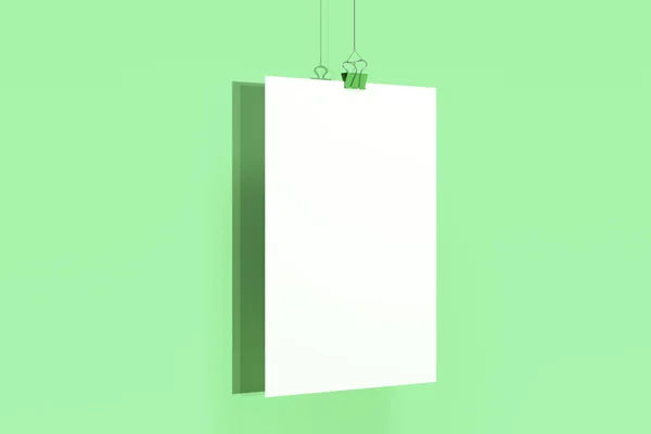 Cartaz branco em branco com mockup grampo de aglutinante no fundo verde — Fotografia de Stock