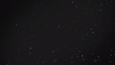 Beyaz bokeh parçacıkları yüzen ile soyut backgrond. Havadaki toz. Ağır çekim