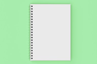 Yeşil arka plan üzerinde bağlı Garı defter spiral