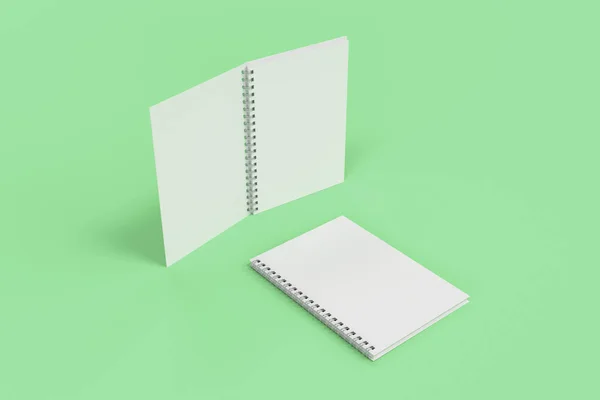 Dos cuadernos con espiral encuadernada sobre fondo verde — Foto de Stock