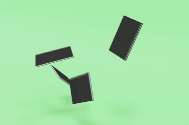 Yeşil arka plan üzerinde dört defter spiral ile bağlı