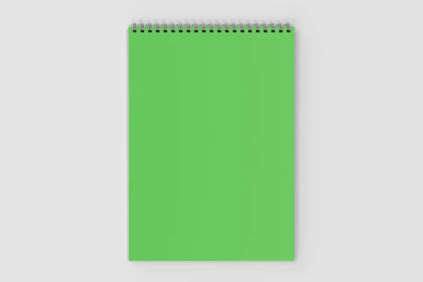 Notebook verde em branco com espiral de metal encadernado no fundo branco — Fotografia de Stock