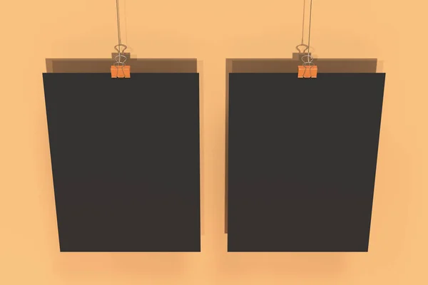 橙色 backgr 的两个空白的黑色海报与粘合剂夹子样机 — 图库照片