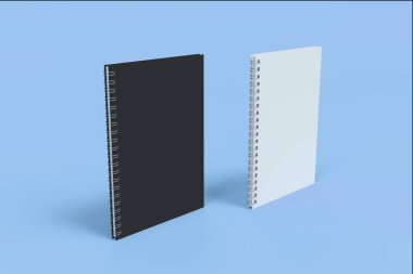 İki defter spiral ile mavi arka plan üzerinde bağlı