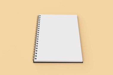 Garı defter spiral turuncu zemin üzerine bağlı