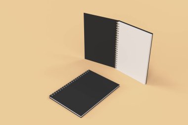 Turuncu zemin üzerine iki defter spiral ile bağlı
