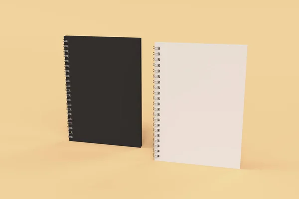 Dois cadernos com encadernação em espiral em fundo laranja — Fotografia de Stock