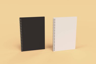 Turuncu zemin üzerine iki defter spiral ile bağlı