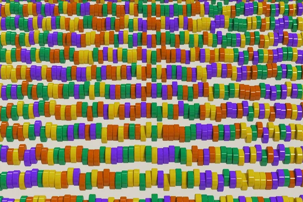 Pattern of yellow, violet and green cylinder tablets on white ba