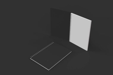 Siyah arka plan üzerine iki defter spiral ile bağlı