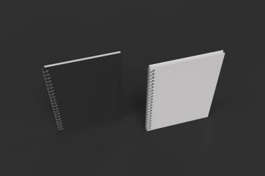 Siyah arka plan üzerine iki defter spiral ile bağlı
