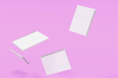 Menekşe arka plan üzerinde dört defter spiral ile bağlı