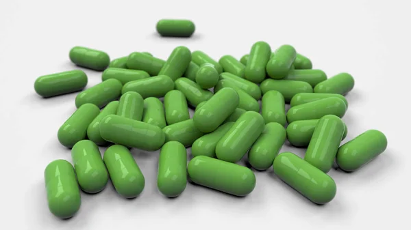 Stapel groene geneeskunde capsules — Stockfoto