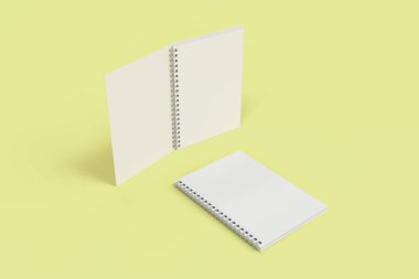 Sarı arka plan üzerinde iki defter spiral ile bağlı