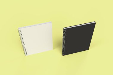 Sarı arka plan üzerinde iki defter spiral ile bağlı